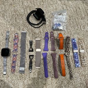 Fitbit Versa 2 Smartwatch. All watch bands included. Charger included.